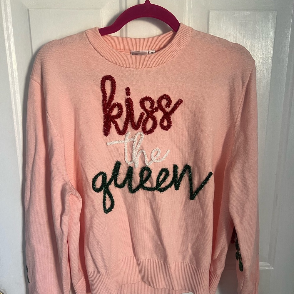 QUEEN OF SPARKLES Pink Sweater with Red and Green Text